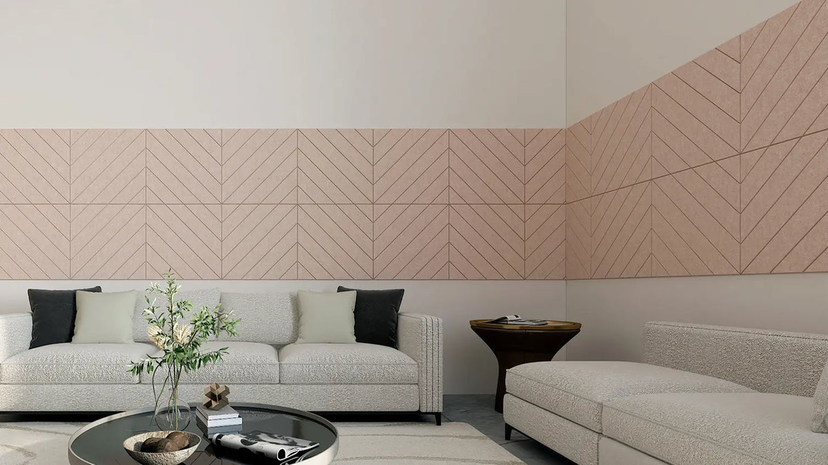 Chevron-pattern noise-absorbing panels installed on the walls in a room with exercise equipment and a plant.