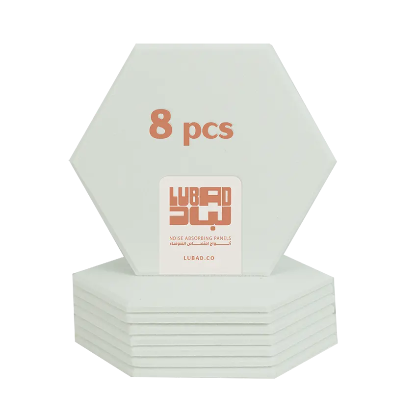 A stack of eight hexagonal noise-absorbing panels by Lubad, shown on a clean white background. The panels are white, with one standing upright to display the text '8 pcs' and a central white label with the orange 'LUBAD' brand logo.