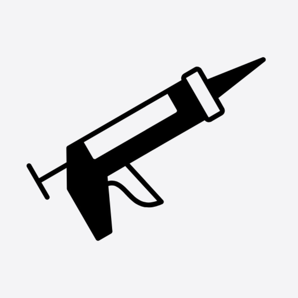 A black and white line art image of a syringe-like installation tool.