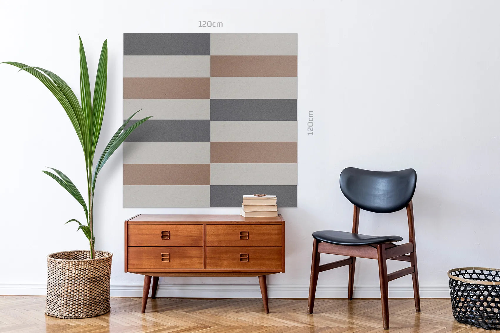 A large square wall art print with a geometric stripe pattern in beige, brown, gray, and off-white, displayed on a white wall in a styled room scene with a mid-century sideboard, chair, and plant. The image includes dimension labels indicating 120cm by 120cm.