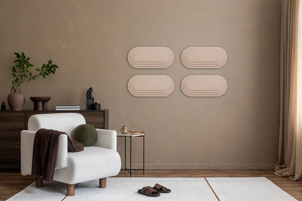 A room with 'Topo' 3D panels on the wall, a wooden table, a beige armchair, a standing lamp, and various decorative items.