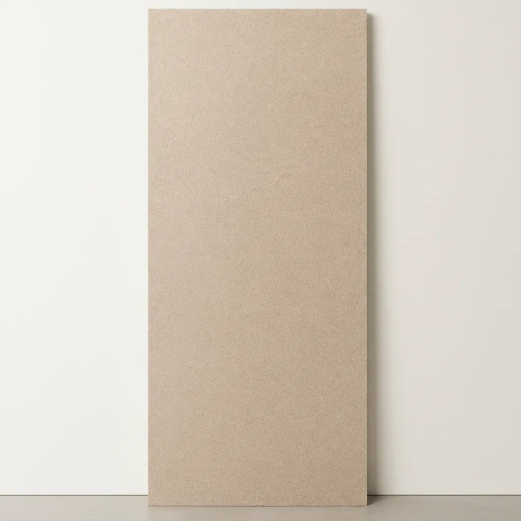 A tall, rectangular beige textured panel or board standing upright against a plain off-white wall on a light gray floor.
