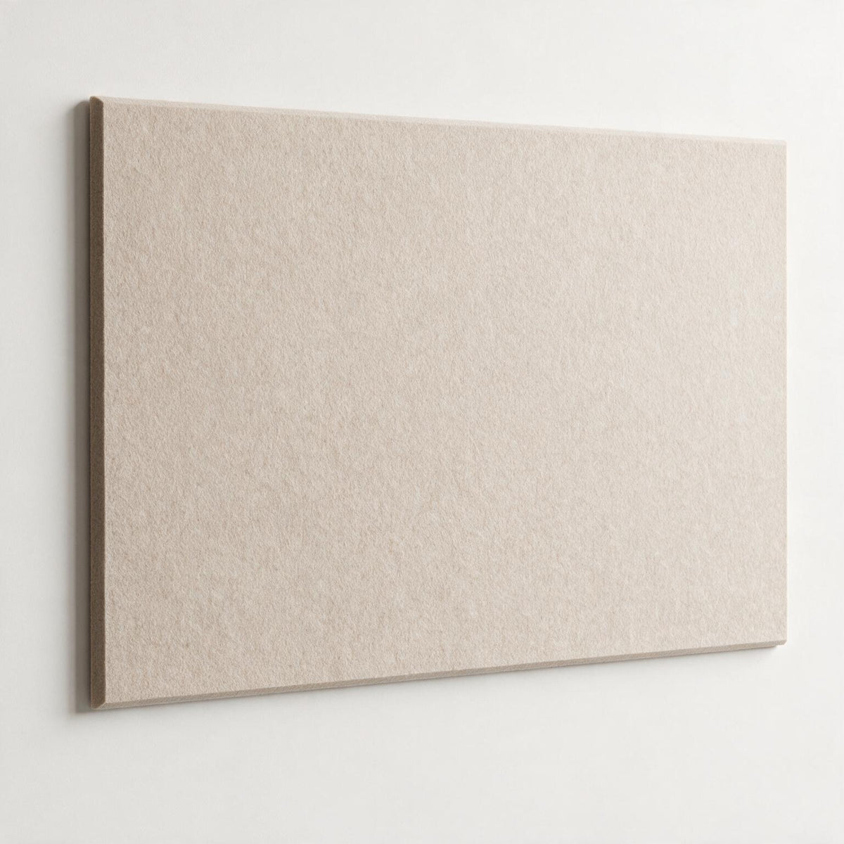 A rectangular beige textured panel or board shown against a plain white wall, with a slight drop shadow indicating depth.