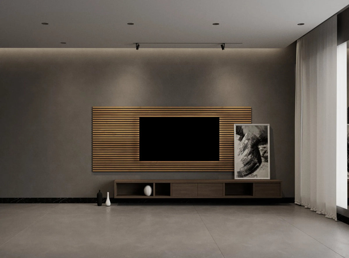 A modern living room interior featuring a wall-mounted wooden slat TV console with a black television, a matching low media stand, and a framed black-and-white artwork on a gray wall.