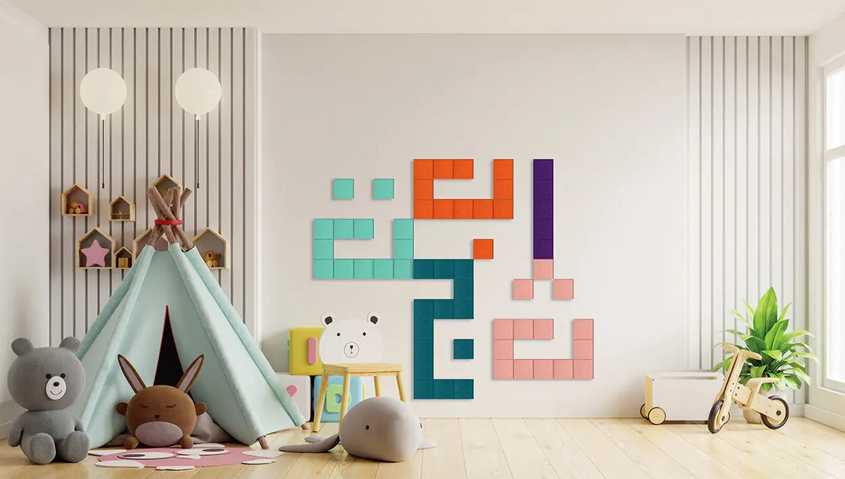 A styled children's room interior with a large colorful geometric wall art piece mounted on a white wall. The piece is made of interlocking square tiles in teal, orange, pink, purple, and dark blue.