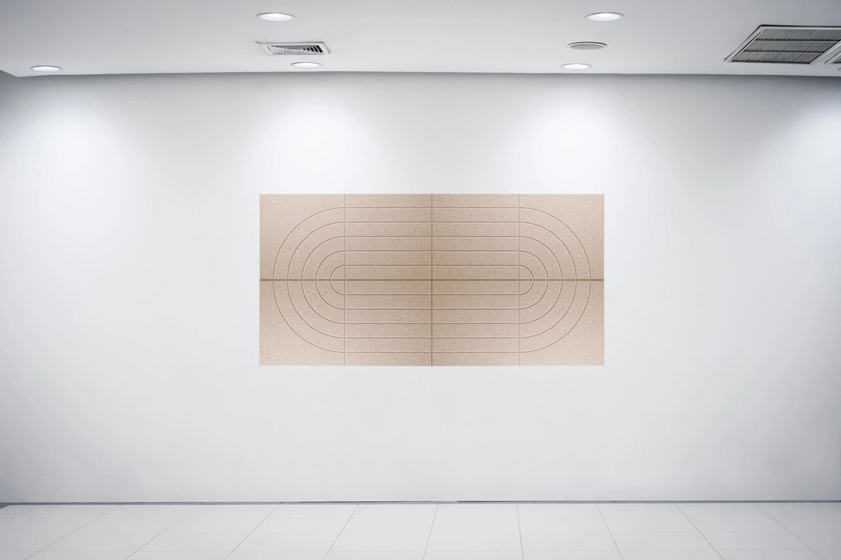 A minimalist abstract wall art piece featuring concentric oval and rectangular grid lines in light beige wood, mounted on a white gallery wall under ceiling spotlights.