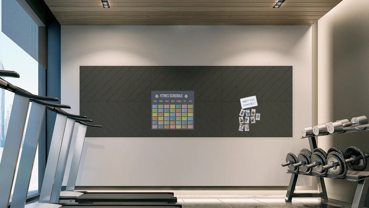Noise-absorbing panels with a chevron pattern installed on a wall in an indoor exercise environment, featuring exercise equipment in the background.