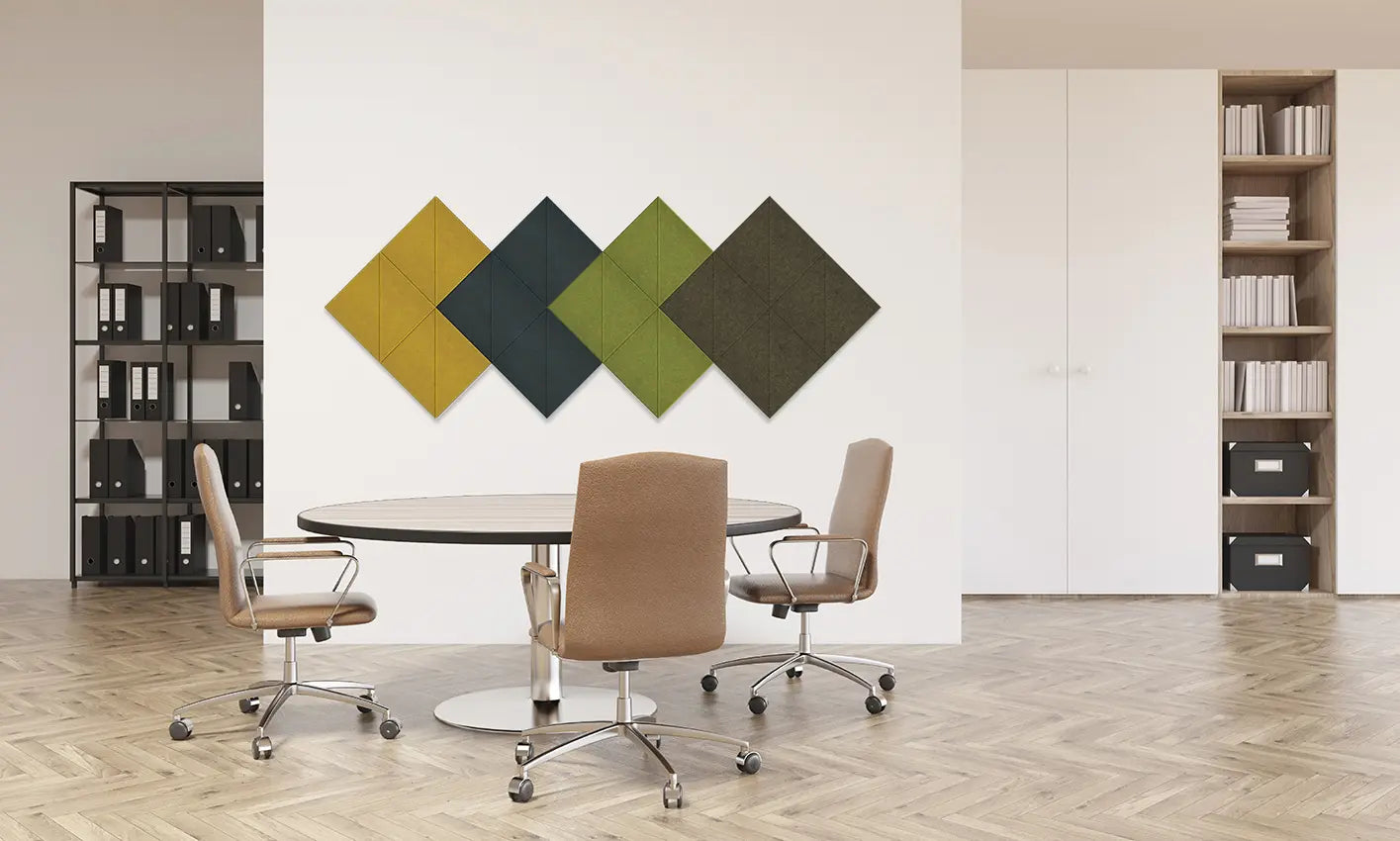 Four diamond-shaped fabric wall panels in mustard yellow, dark teal, olive green, and dark brown are mounted on a white wall in a modern office setting with a round table and three office chairs.