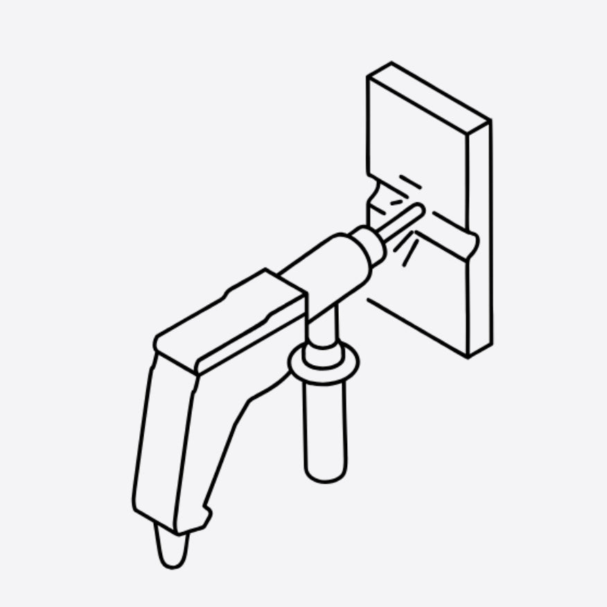 Line drawing of a decorative item being installed onto a wall using a mounting tool.