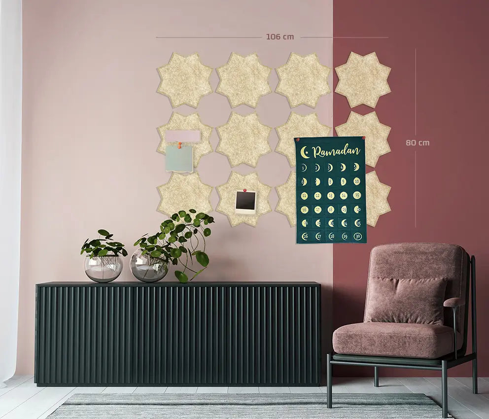 A wall-mounted Islamic calendar and photo collage board styled in a modern living room. The calendar features a dark green background with gold moon phases and the word 'Ramadan' at the top.