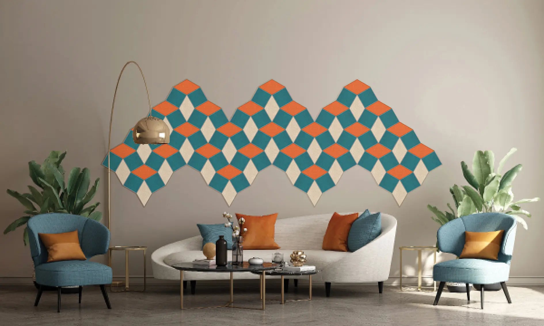 A modern living room scene featuring a large geometric wall mural with a repeating diamond pattern in teal, orange, and off-white. The room includes a curved white sofa with blue and orange pillows, two blue armchairs with orange accent pillows, a coffee table, and potted plants.
