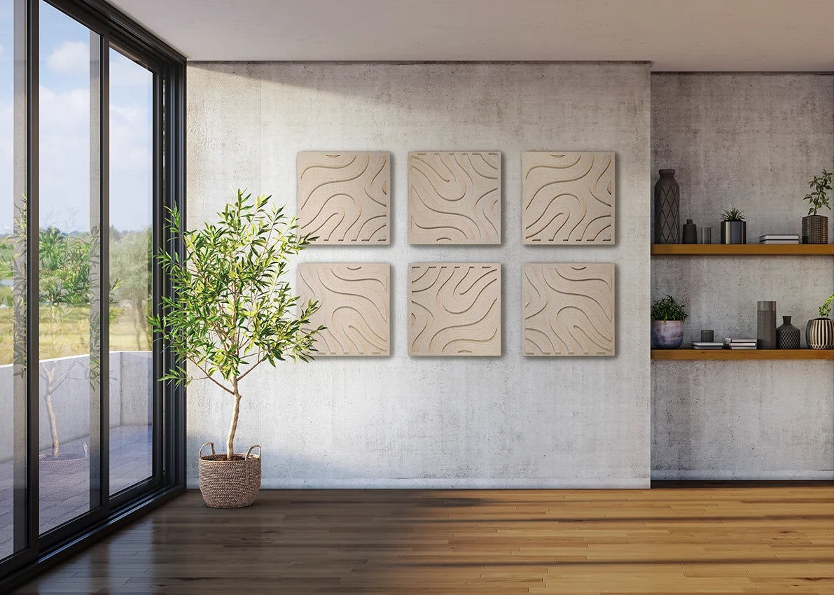 Six square beige wall art panels with wavy line patterns arranged in two columns on a light textured wall in a modern room with wood flooring, a potted tree, and shelving.