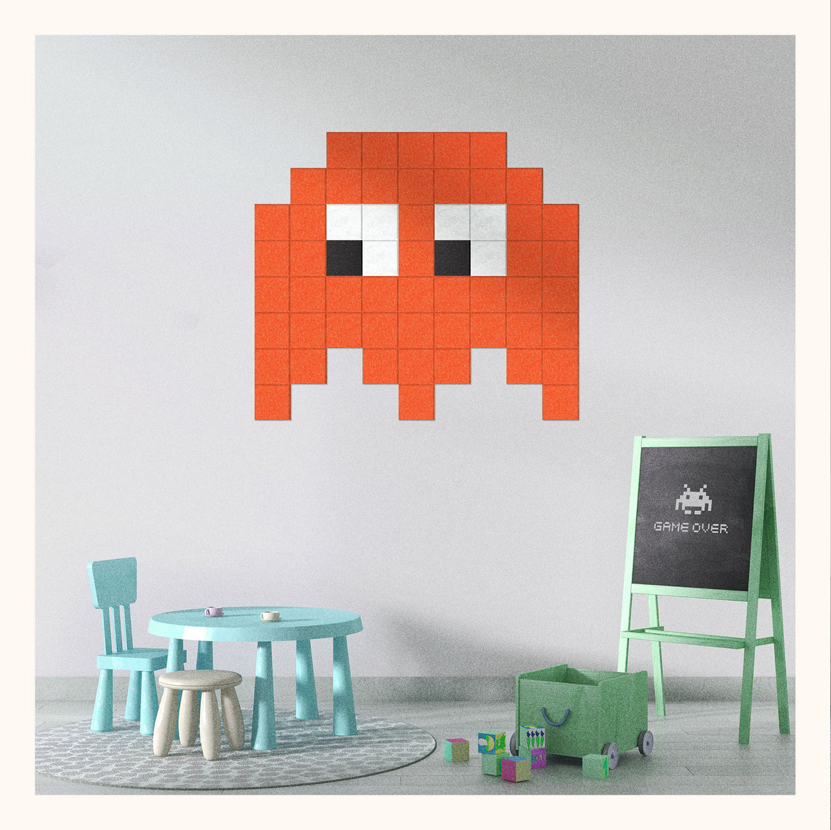 Pixel wall art featuring a red Space Invader character styled in a pixelated art format, displayed on a white wall above children's furniture.