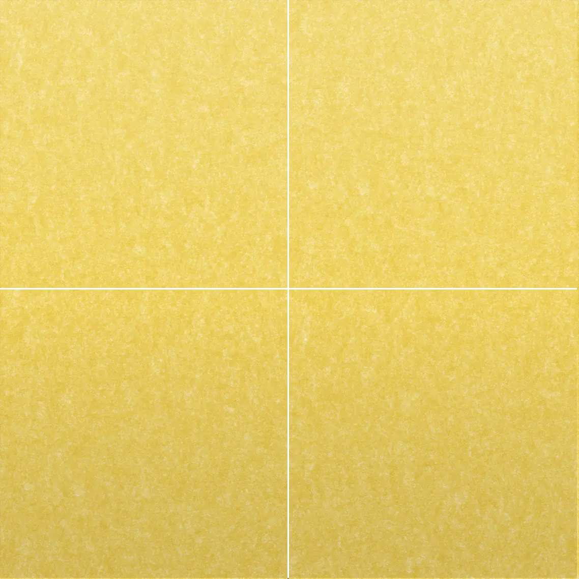 A close-up of a textured yellow material, shown in a four-quadrant grid with thin white dividing lines.