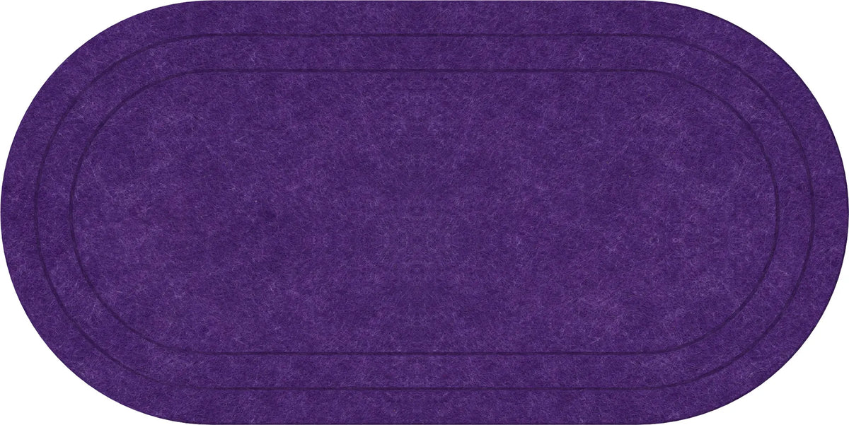 An oval-shaped purple rug with a textured felt-like surface and double stitched border lines, shown against a plain white background.