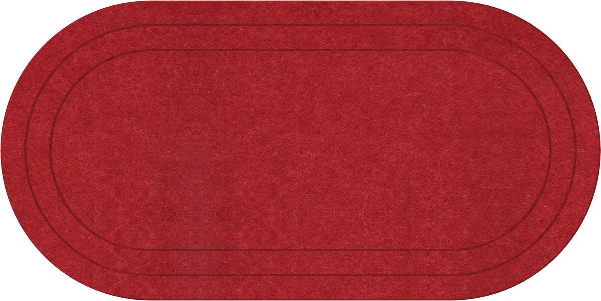 An oval-shaped red rug with a textured surface and double dark brown concentric border lines, shown against a plain white background.
