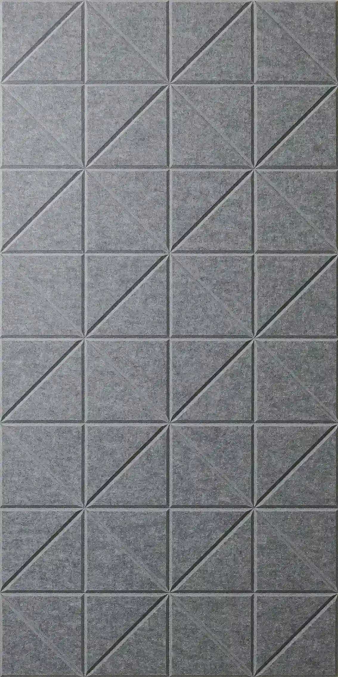 Gray textured wall panels with a repeating geometric pattern of raised diagonal lines forming triangles.