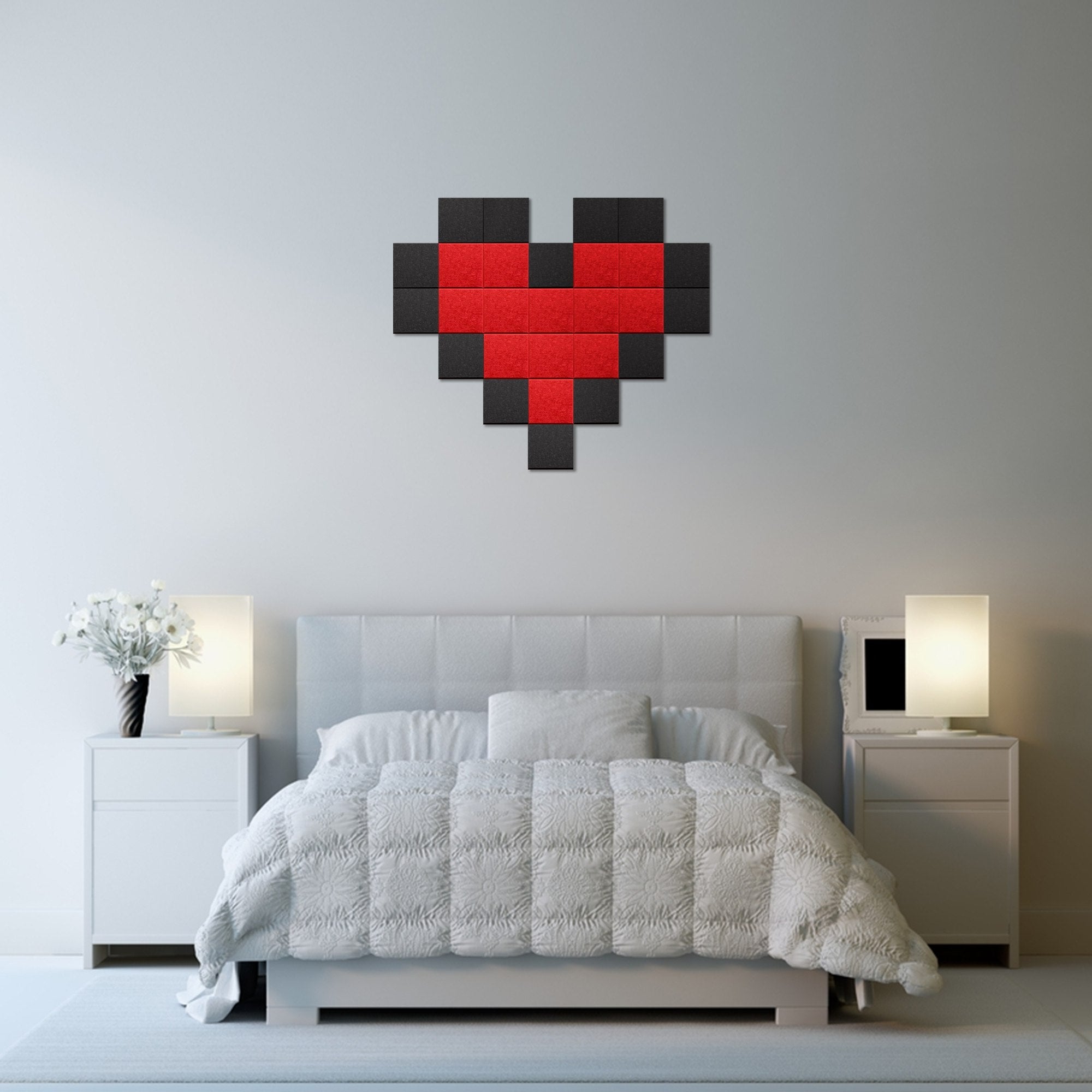 A pixel heart wall panel in red and black mounted above a bed in a bedroom setting
